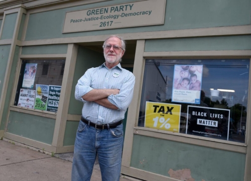 Howie Hawkins in front of store front